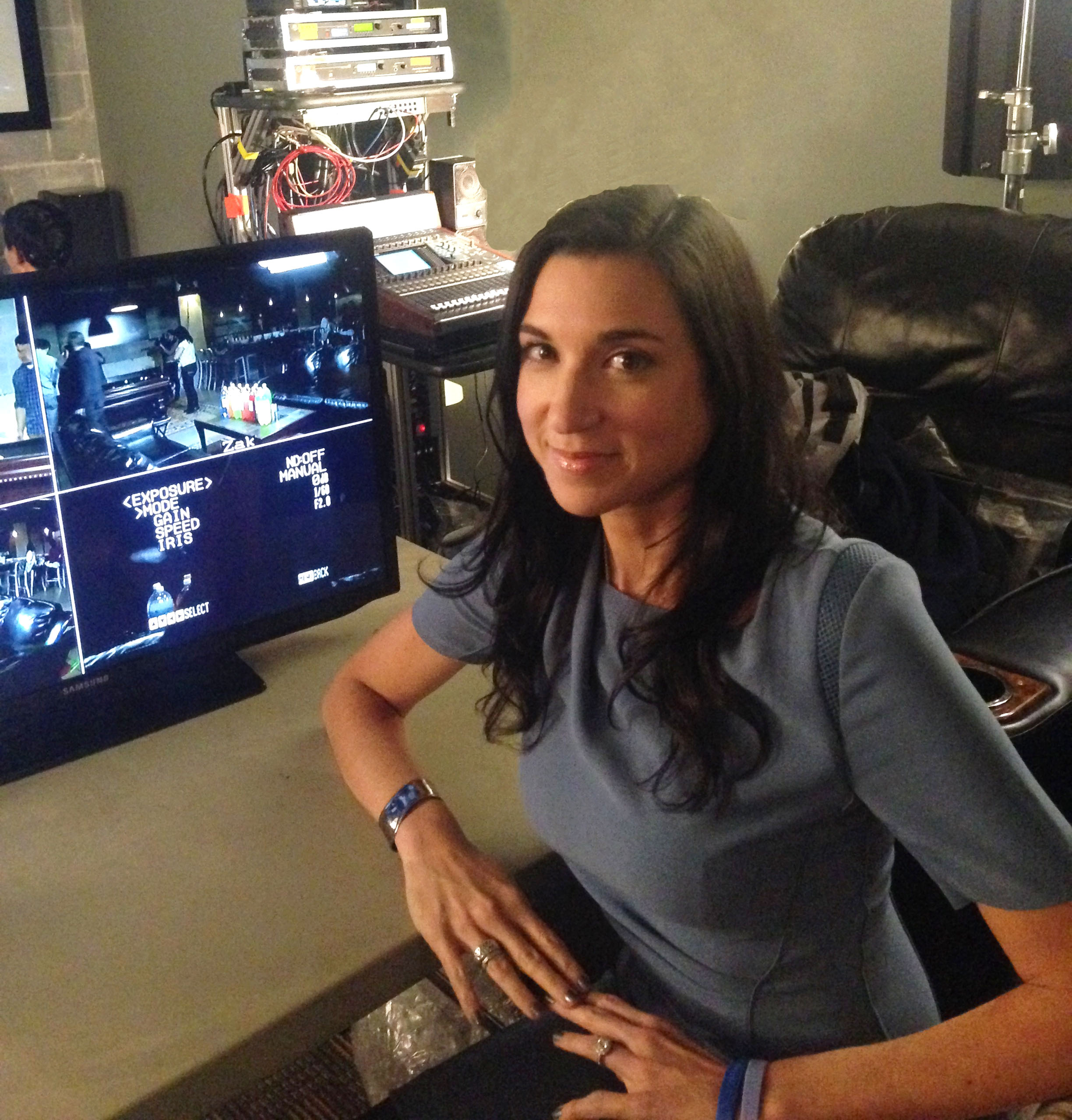 Sexual assault survivor Jacqueline behind the scenes of the NBC's Dateline poses with a computer.