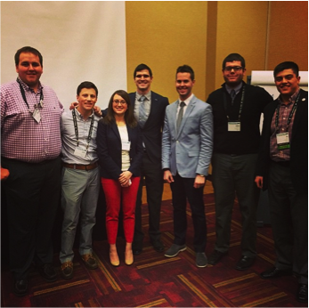 Chelsea Bowers, director of development for RAINN, poses with members of NIC while at a conference