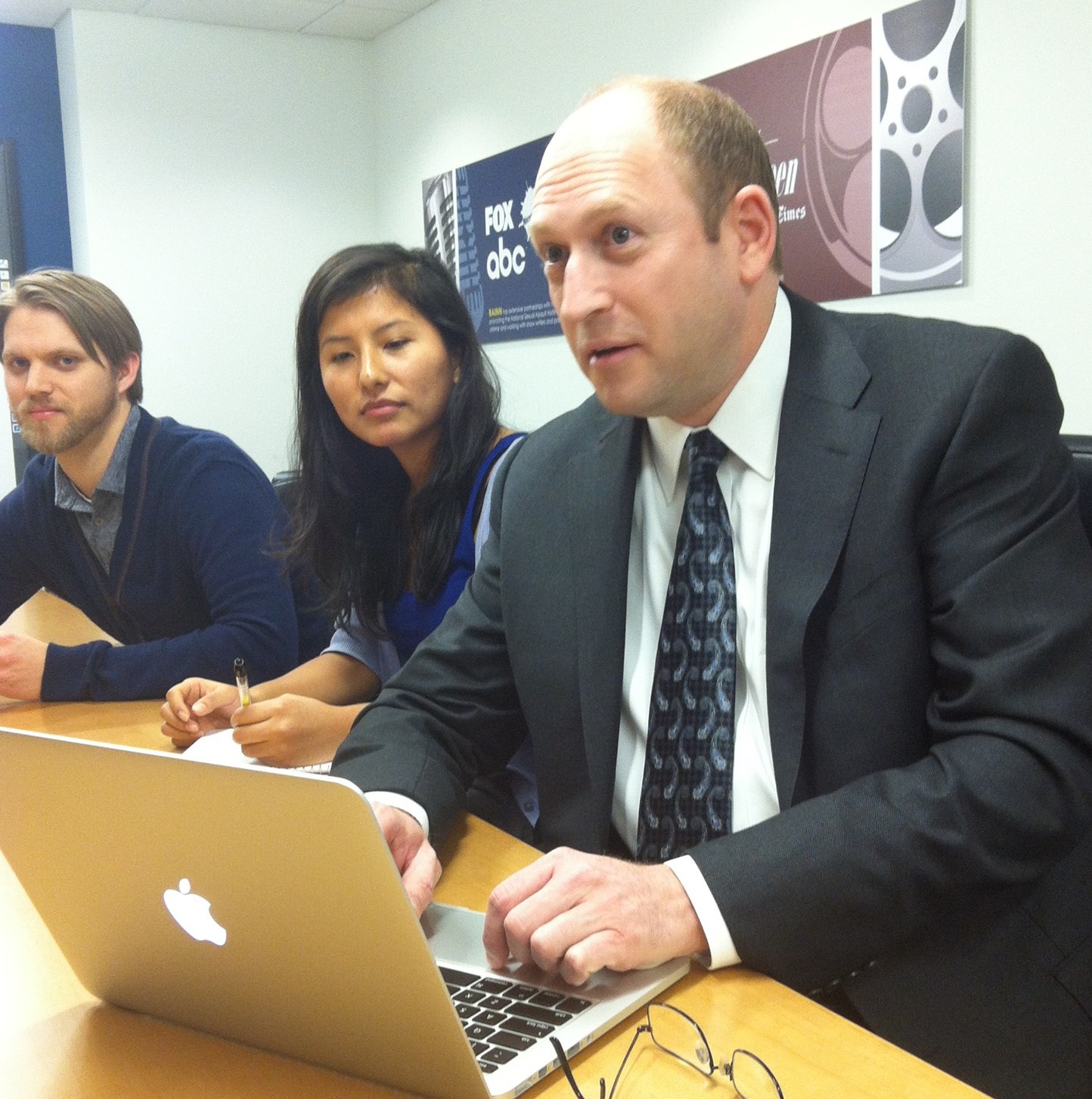 RAINN founder Scott Berkowitz with a laptop answering questions from facebook