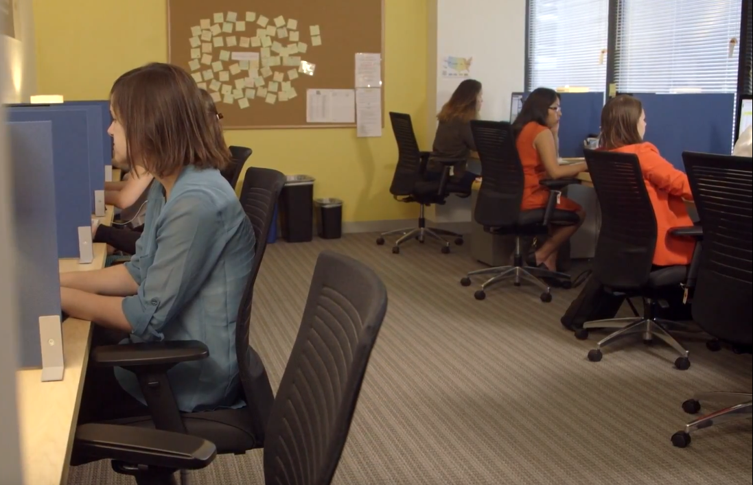 RAINN's online hotline volunteers sit at cubicles typing on computers. Volunteers like these give advice on how to talk to teens.  